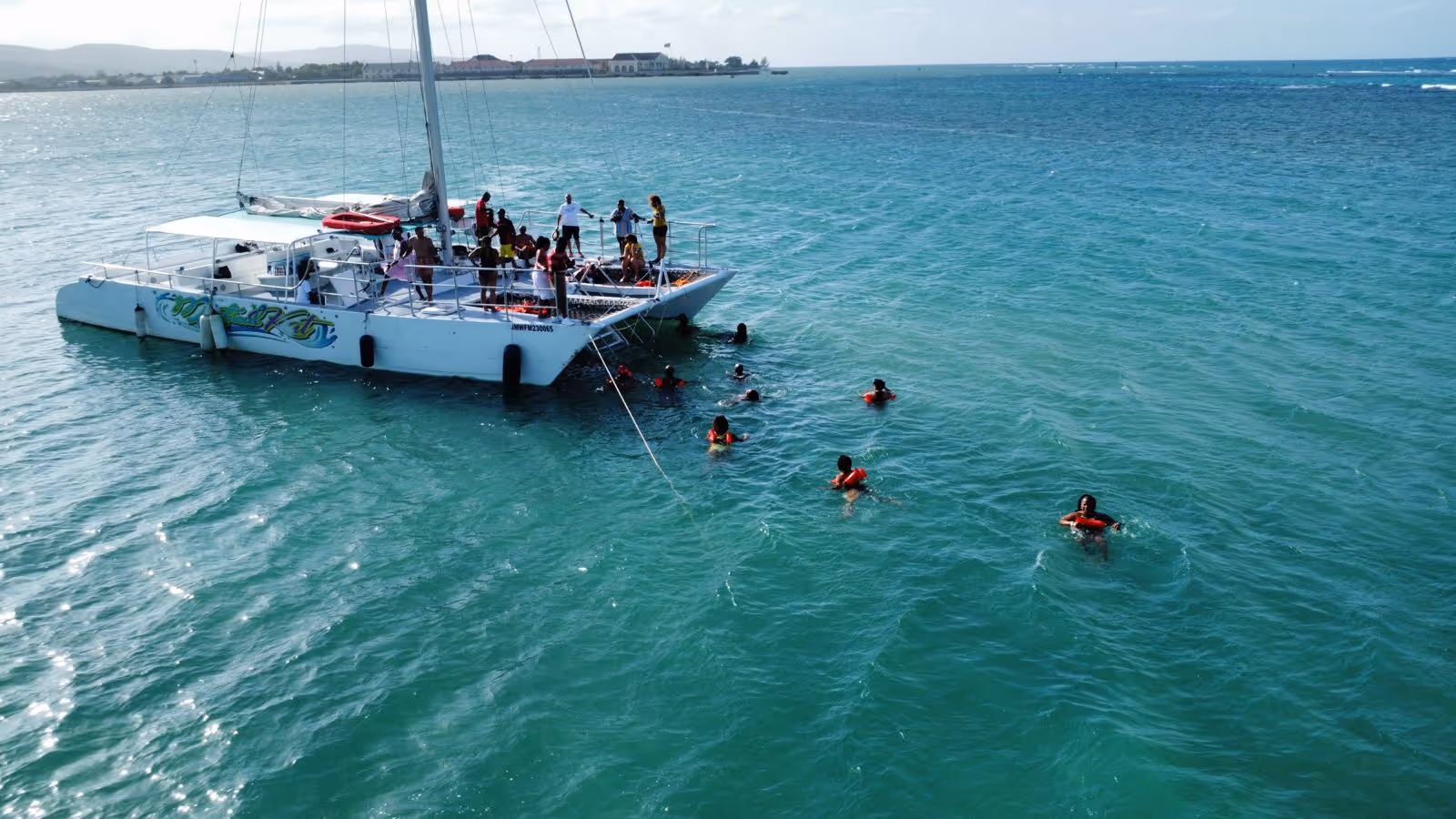 A catamaran sailing the Jamaican coastline